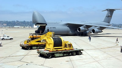 An US Air Force plane is loaded with gear for a mini-submarine rescue mission.