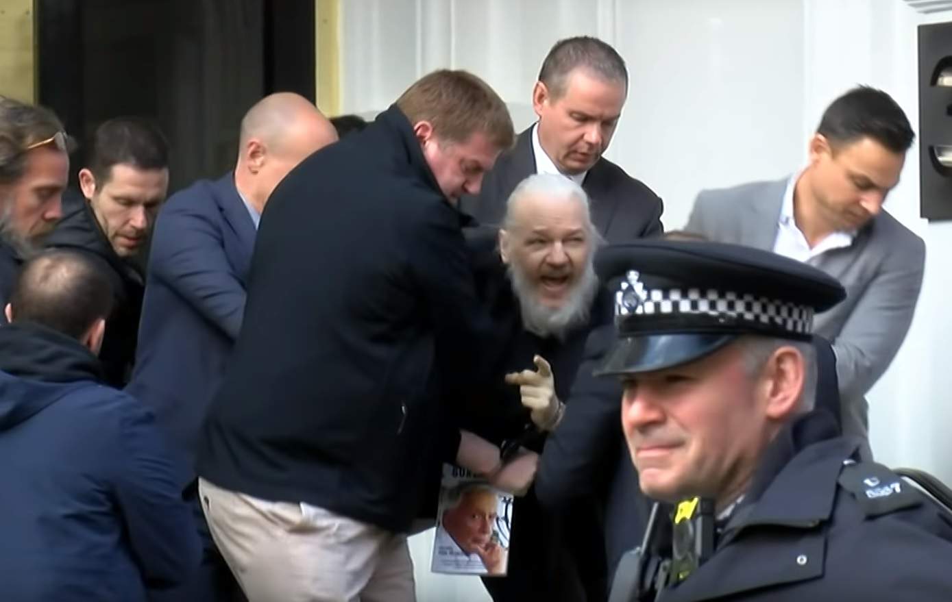 Julian Assange is arrested by UK police.