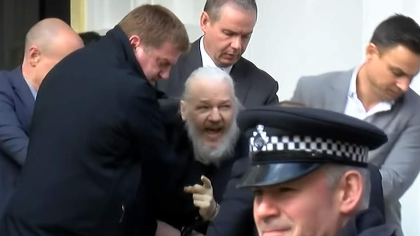 Julian Assange is arrested by UK police.