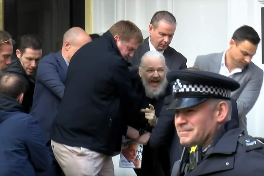 Julian Assange is arrested by UK police.