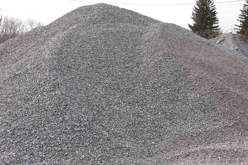 A close up of a pile of grey road gravel.