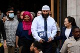Adnan Syed walks out of the courthouse. 