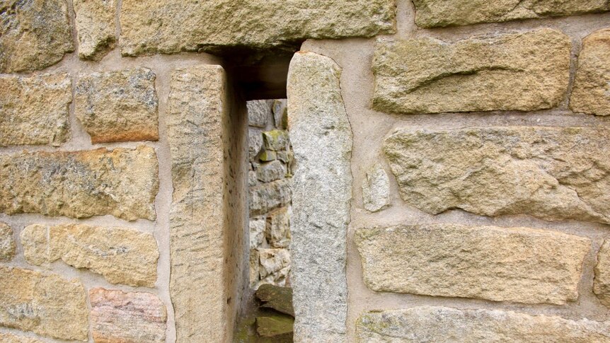 Firing slot in the stone wall of the early 1800s granary at the Windmill Hill heritage site near Appin, NSW.