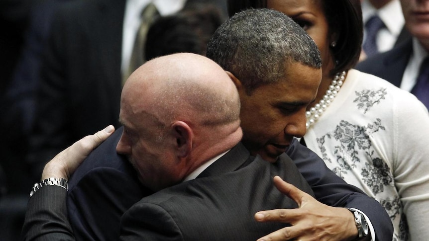 Barack Obama hugs NASA shuttle commander Mark Kelly