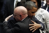 Barack Obama hugs NASA shuttle commander Mark Kelly