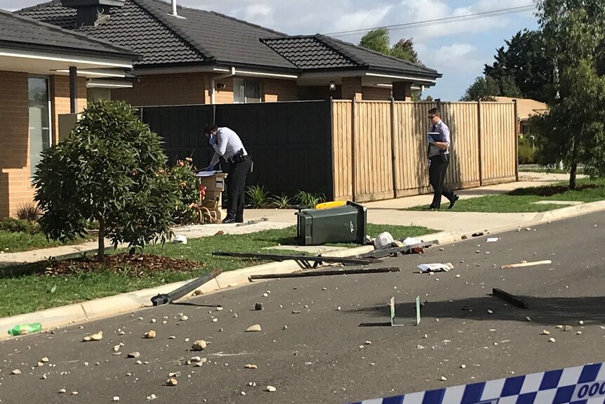 Detectives at the scene after partygoers trash a house in Werribee.
