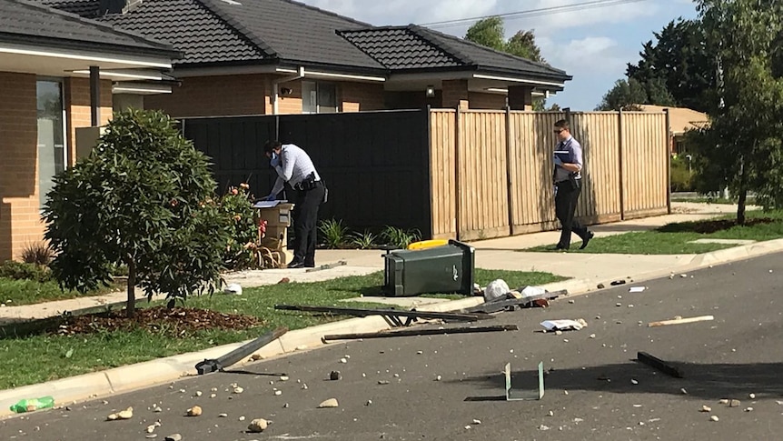 Detectives at the scene after partygoers trash a house in Werribee.