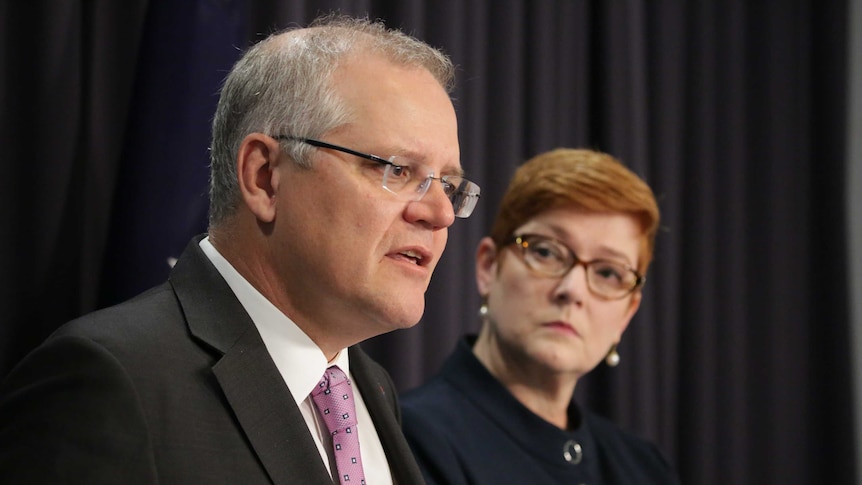 Senator Payne looks on as Mr Morrison answers a question.