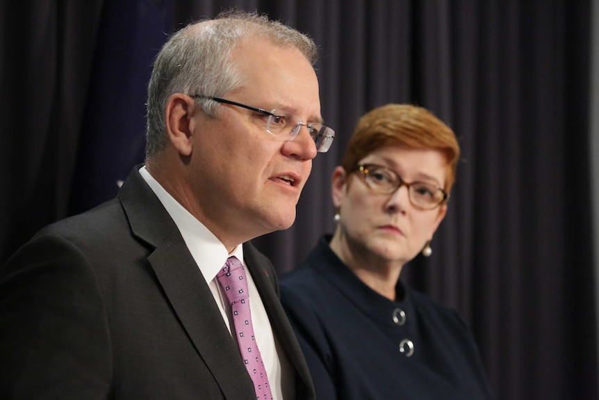 Senator Payne looks on as Mr Morrison answers a question.