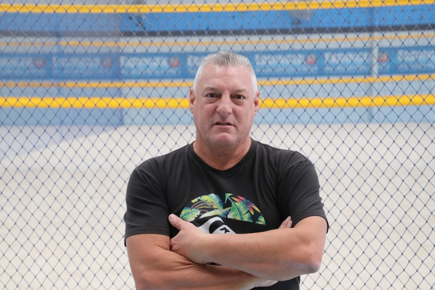 Darrel Fox standing in his indoor beach volleyball centre.