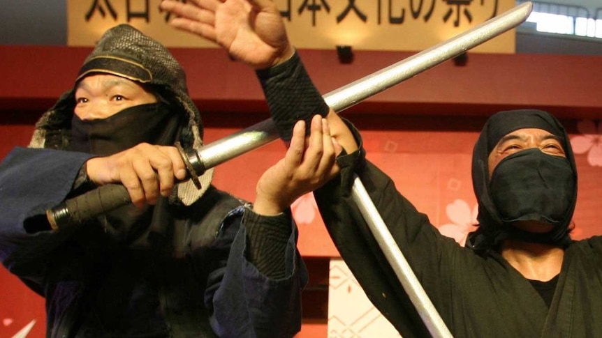 Japanese Iga-ryu Ninjas pose after a performance during a Japanese Cultural Festival in Hong Kong.