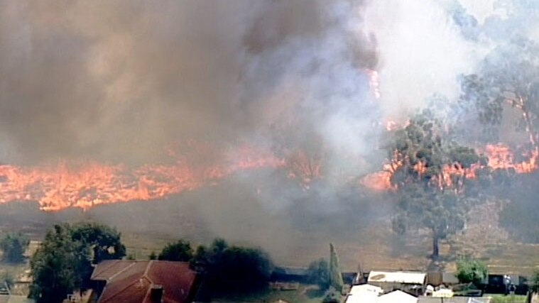 A fire burning dangerously close to houses at Carrum Downs.