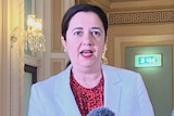Annastacia Palaszczuk delivers a media conference flanked by Deputy Premier Steven Miles and CHO Jeannette Young