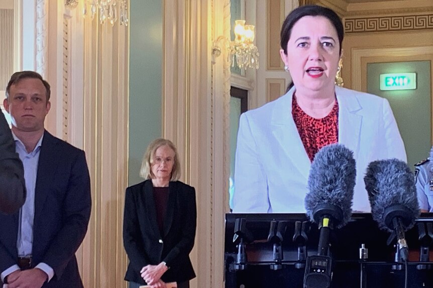 Annastacia Palaszczuk delivers a media conference flanked by Deputy Premier Steven Miles and CHO Jeannette Young