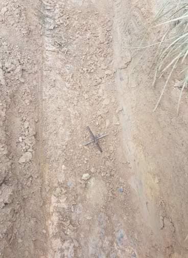 The traps were placed in the dirt in an apparent attempt to stop four wheel drives and bikes from using the trails.