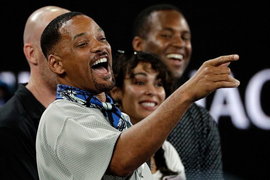 Will Smith laughing in the crowd after watching Nick Kyrgios play Jo-Wilfried Tsonga at the Australian Open.