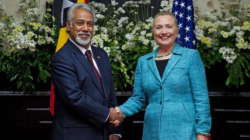 US Secretary of State Hillary Clinton shakes hands with East Timor Prime Minister Xanana Gusmao