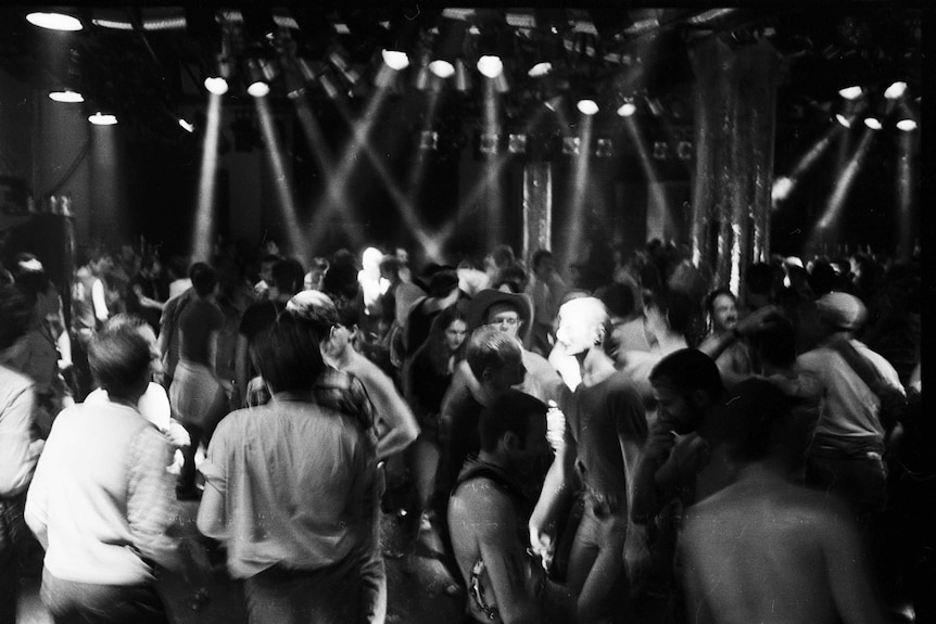 A black and white image of a queer party in the early 80s