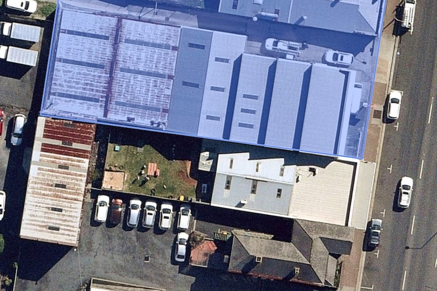 A blue outline for a building on a satellite image of a Burnie Street.