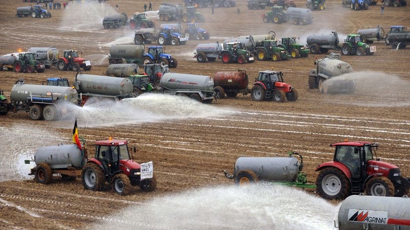 Belgian farmers dump three million litres of milk in a field in Ciney, southern Belgium