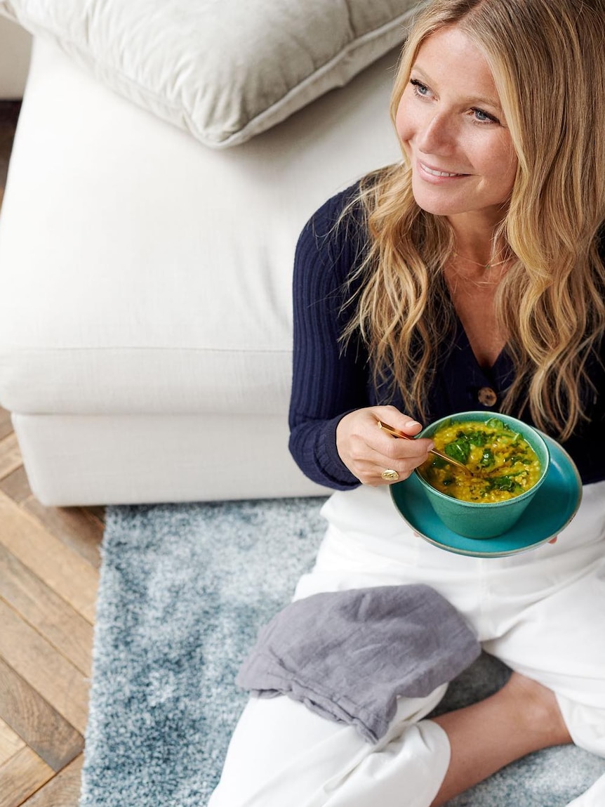 Gwyneth Paltrow eats soup as part of a promotion for Goop.