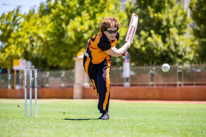 A woman playing blind cricket.