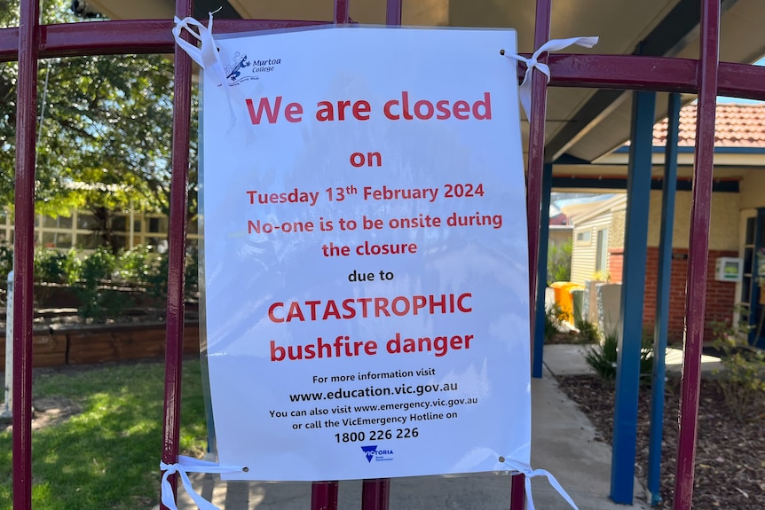 A sign on a school announcing a closure due to fire dange