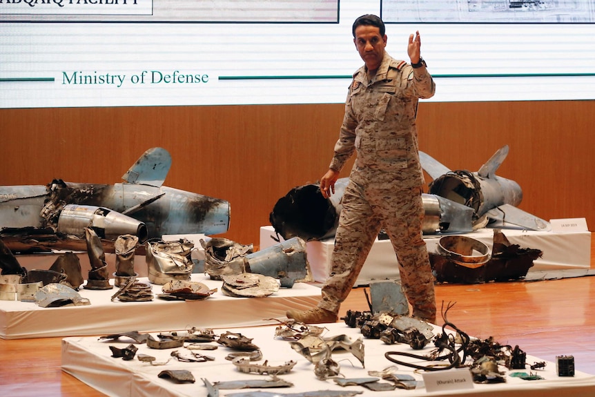 Saudi military spokesman Colonel Turki al-Malki stands in front of what he said were Iranian cruise missile and drones.
