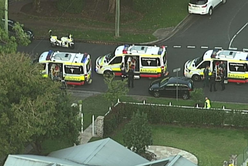 Ambulances at the scene in a street at Chelmer where a woman was killed in a boat accident