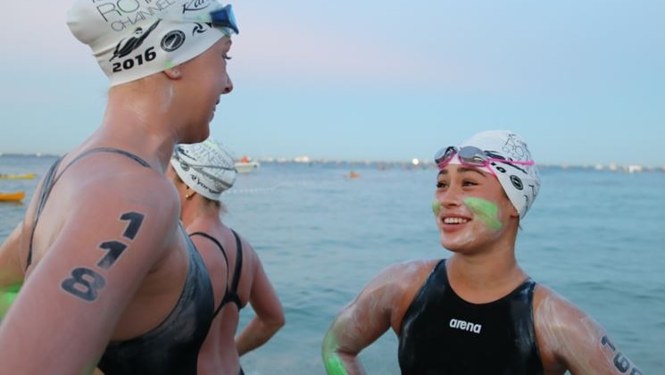 Sabrina Seitz and her friend about to compete in the Rottnest swim at Cottesloe beach in Perth.