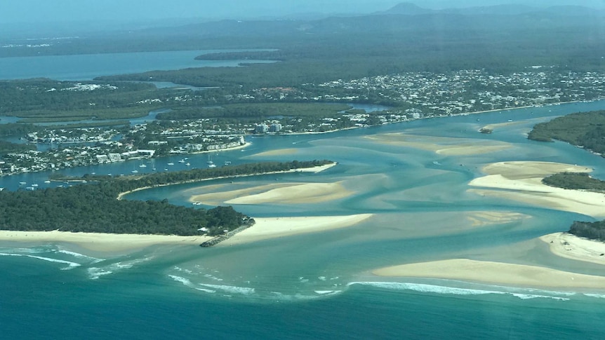 An aerial photo showing all of the sand build up in the mouth of the Noosa river.