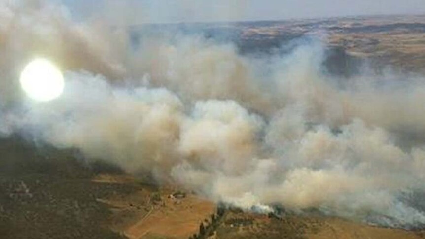 Smoke rises from the Yarrabin bushfire