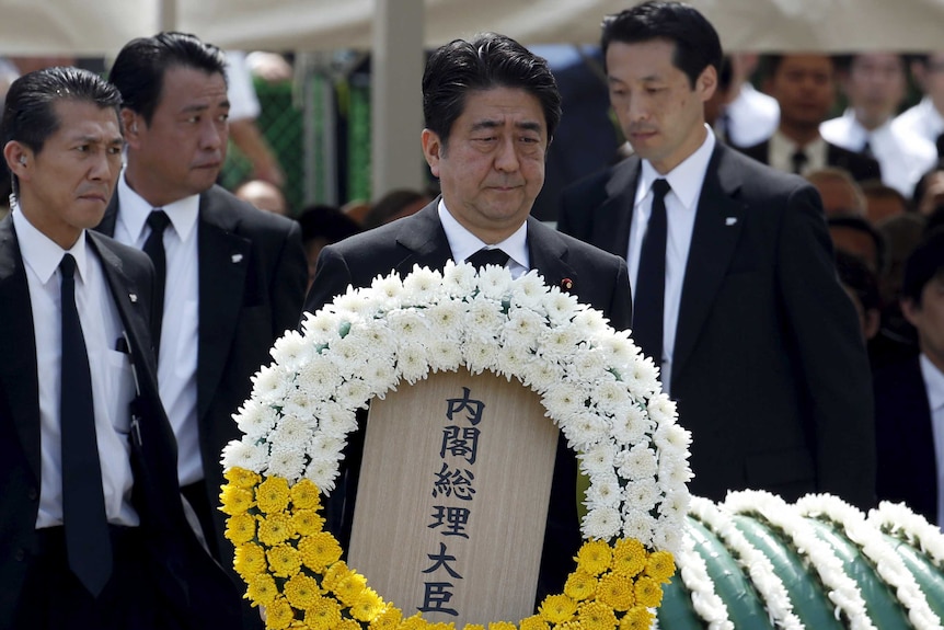 Japan prime minister Shinzo Abe lays a wreath on 70th anniversary of Nagasaki bombing