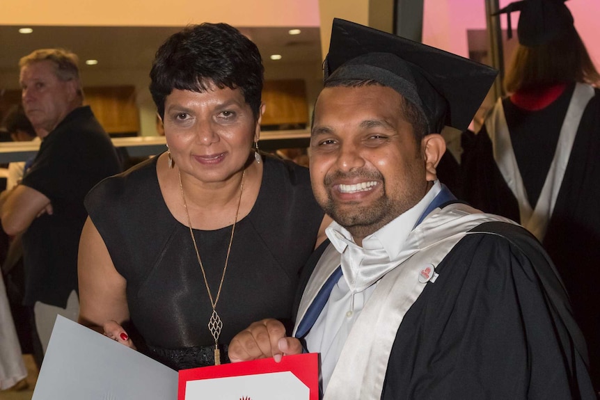 Dinesh with his mother after graduating