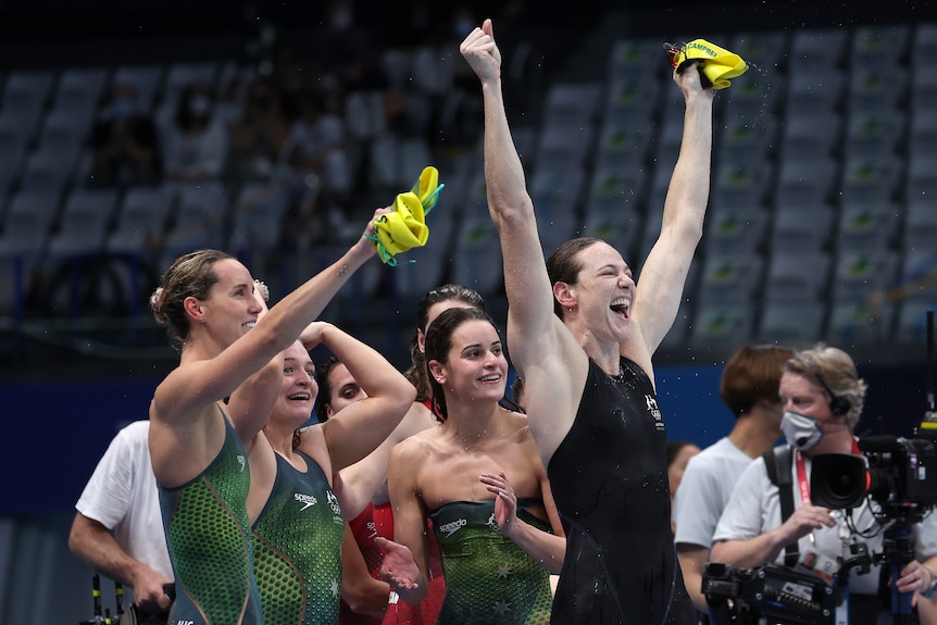 Female swimmers celebrate after winning 4 x 100m medley at Olympics