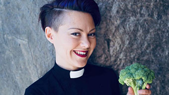 Swedish priest Rev Jennie Hogberg holding head of broccoli.