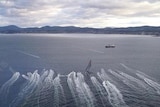 Sydney-Hobart leader Wild Oats X1  heads to the finish line in the River Derwent last year.