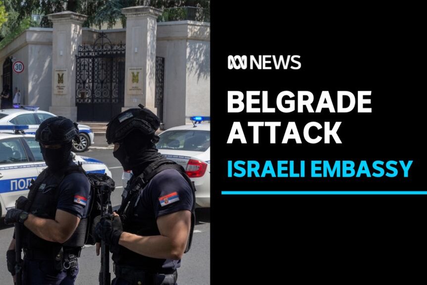 Belgrade Attack, Israeli Embassy: Two police officers on the street carrying automatic weapons wearing balaclavas.
