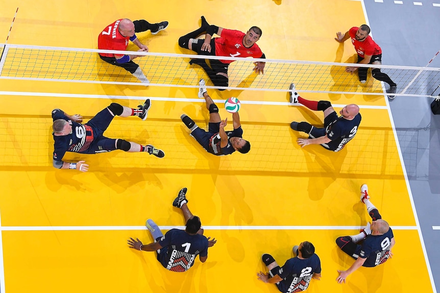 The Georgian sitting volleyball team plays a point against the United Kingdom at the Invictus Games