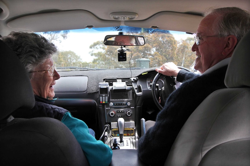 Mary and Geoff McDonnell in a taxi