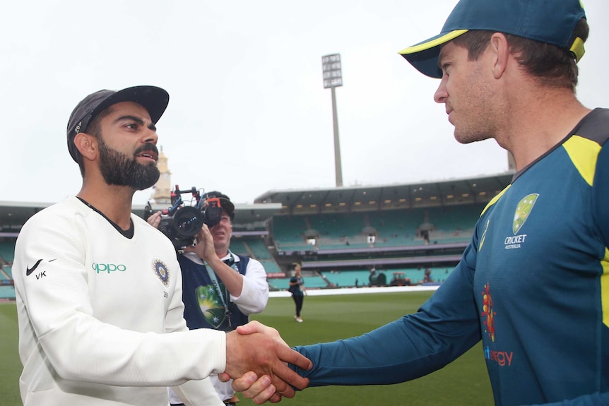 India captain Virat Kohli and Australia captain Tim Paine shake hands at the SCG after the Test series between their teams.