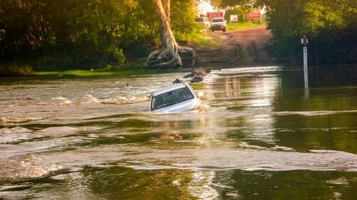 Great Wall vehicle stranded at Cahill's Crossing in Kakadu National Park