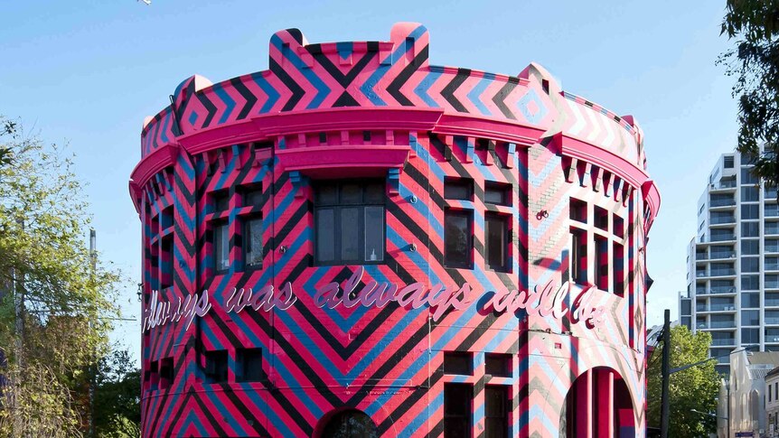 Pink, blue and black building.