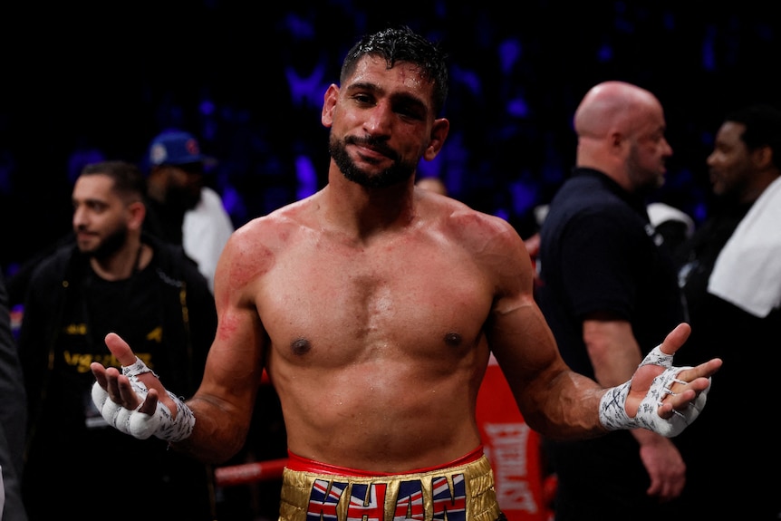 Amir Khan looks dejected after losing the fight.