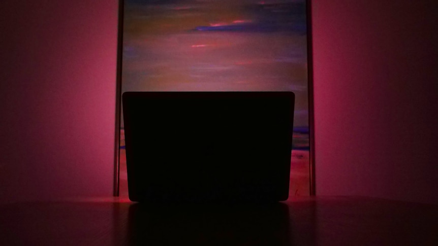 Laptop in dark.