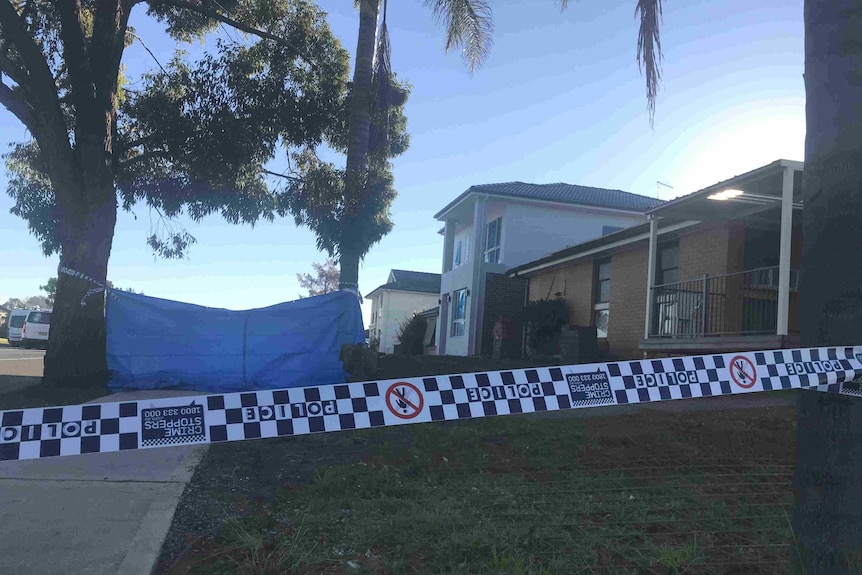 A house with a police emergency sign out the front.