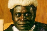 A Bougainville man dressed in judge's robes and wig