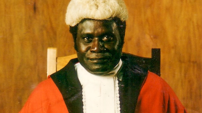A Bougainville man dressed in judge's robes and wig