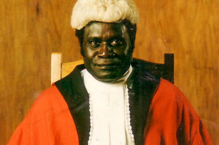 A Bougainville man dressed in judge's robes and wig