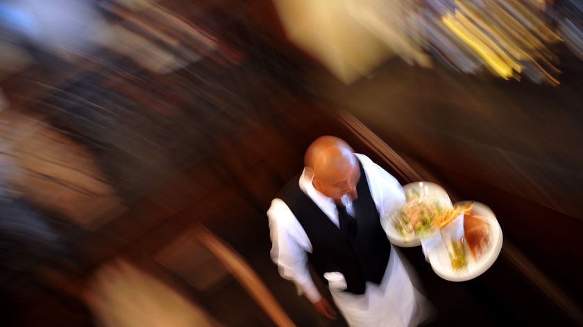 Waiter carries dishes, good top-down generic